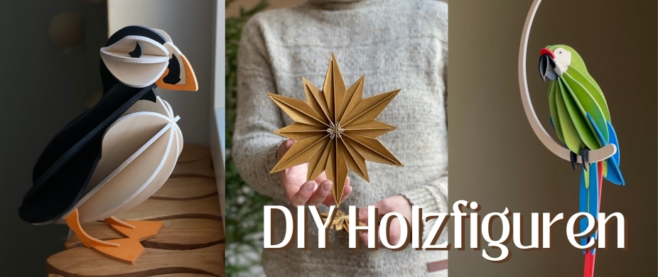 Handgebastelte Holzdeko wie Papageitaucher, Weihnachtsstern und Papagei
